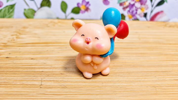 Figura cerdito con globos