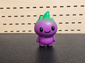 Figura decorativa de fantasma morado y verde