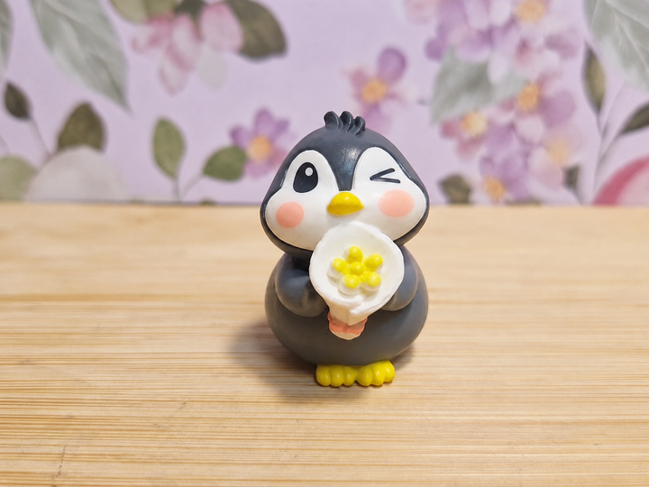 Figura pingüino con palomitas